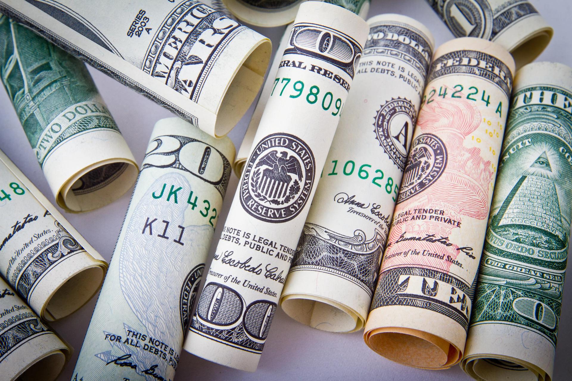 Several bank rolls made up of $100 notes
